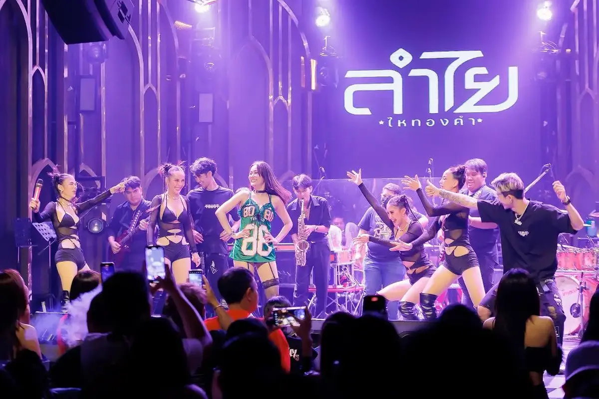 Live band in Booze Club with men playing instrument and sexy ladies singing and dancing on the stage
