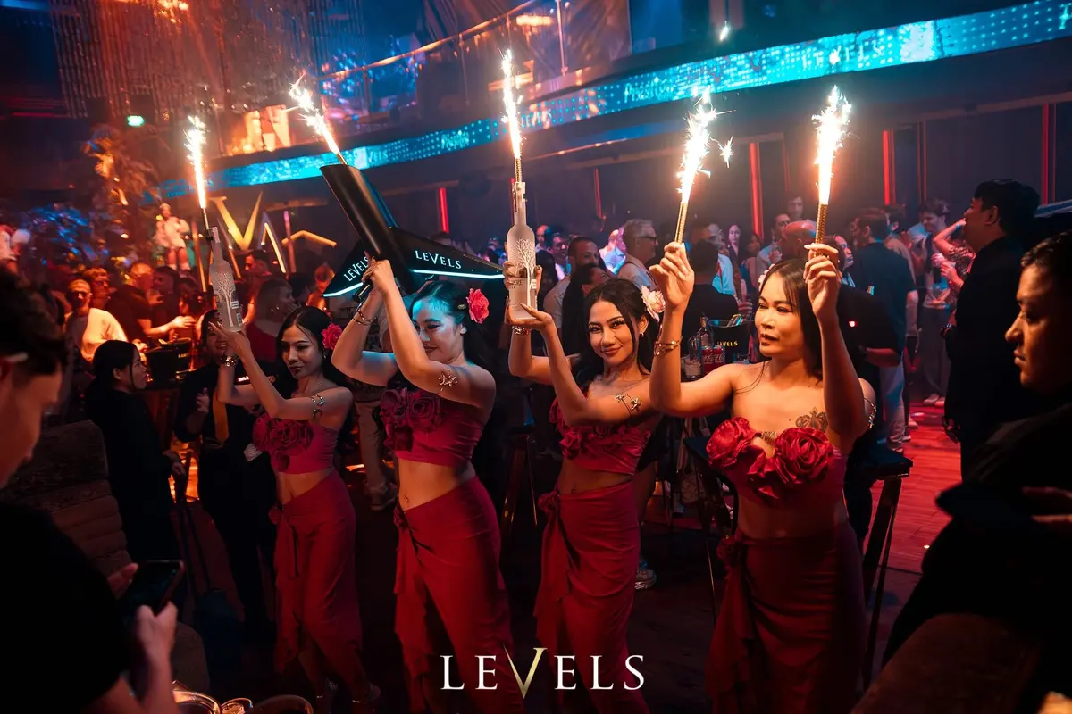 Hostesses holding bottles of Belvedere Vodka in VIP tables in Levels nightclub in Sukhumvit Soi 11