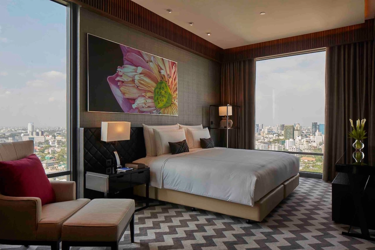 interior of a luxury suite at 137 Pillars in Bangkok overlooking the city