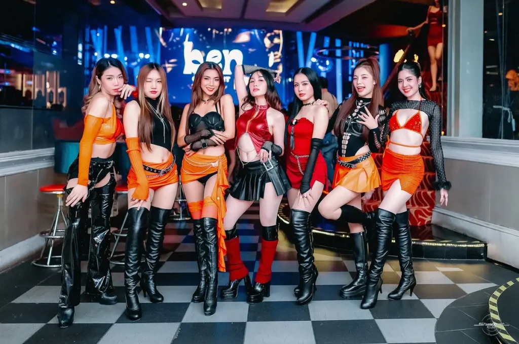 Hot Thai girls posing in line wearing sexy black leather boots